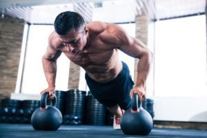 Muscular endurance training. Kettlebell push ups.