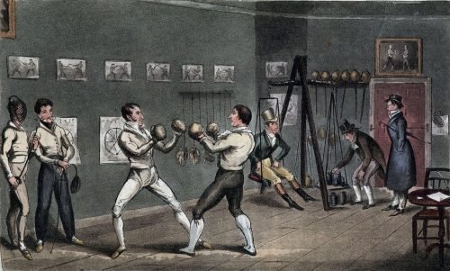 Two aristocratic men boxing in a private club during the late 1800s, showing boxingβs transformation into a gentlemanβs sport.