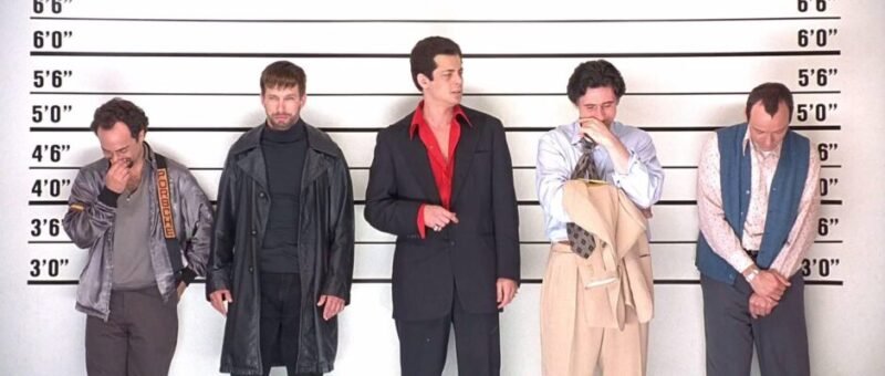 The Usual Suspects. Bryan Singer (Director). Kevin Spacey. Gabriel Byrne. Benicio Del Toro. Stephen Baldwin. Kevin Pollak. Crime thriller. Iconic lineup. Criminal crew. Mystery film. Classic cinema. 1995 movie. Key characters. Police lineup. Suspenseful story. Ensemble cast.