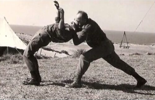 Historical images showing Imi Lichtenfeld, early Krav Maga development, and Israeli military training environments.