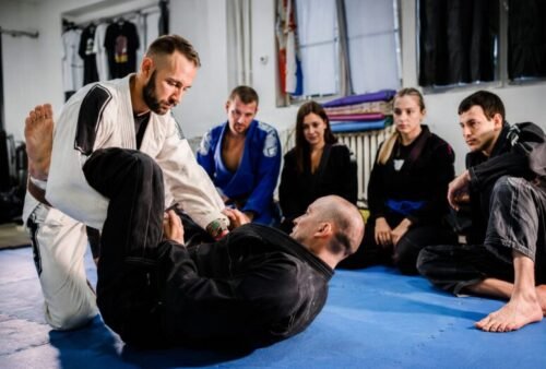 Brazilian Jiu-Jitsu students training with a resisting partner during practice.
